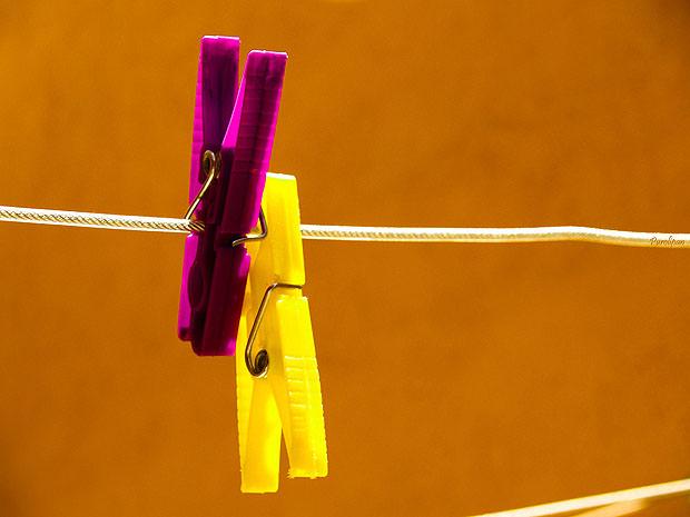 Two colourful pegs on a line