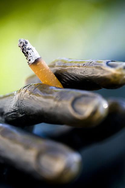 Statue's hand holding cigarette