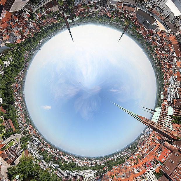 Inside out planet photo with sky surrounded by buildings