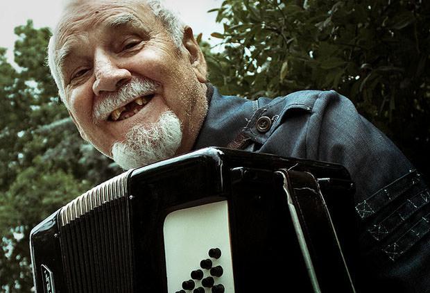 Old man playing the accordion