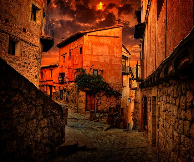 Spanish street at sunset, framed with buildings